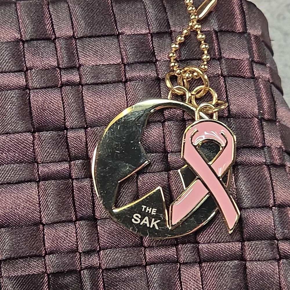 The Sak Woven Satin Baguette Shoulder Bag Breast Cancer Awareness Charm Minimal